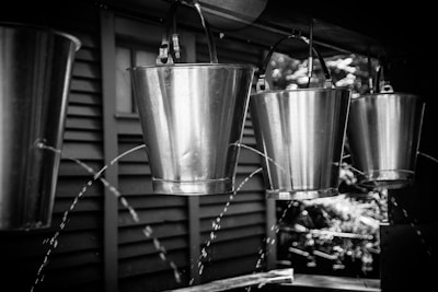 A close-up of sturdy water buckets filled with fresh water, ready for delivery.
