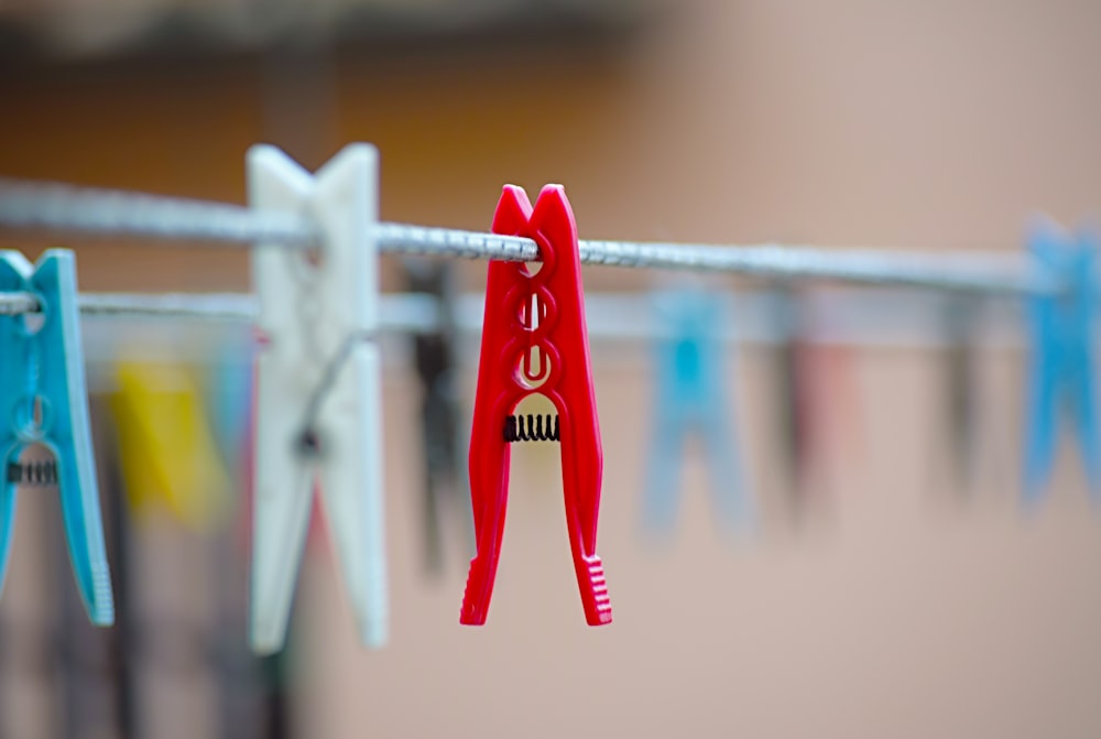 red plastic clothes peg