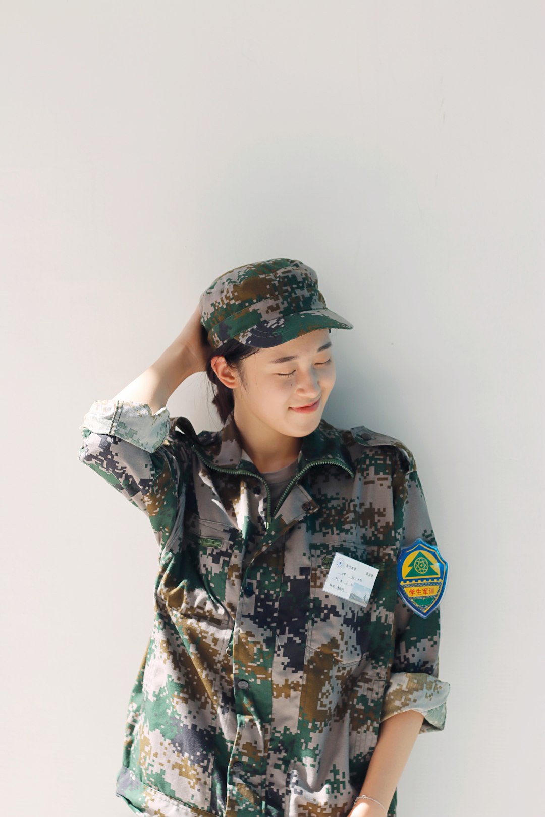 woman wearing camouflage uniform