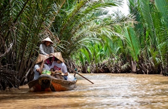 group of people riding on canoe