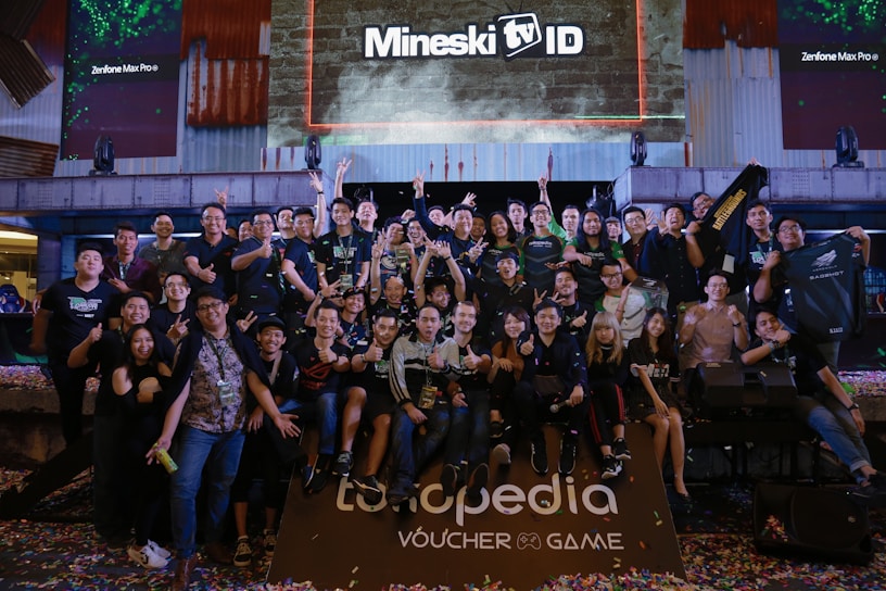 A group photo of enthusiastic Spartan promoters celebrating a successful event in Pangkalan Bun.