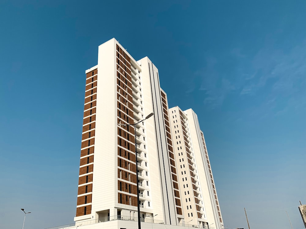 white and brown high-rise building during daytime