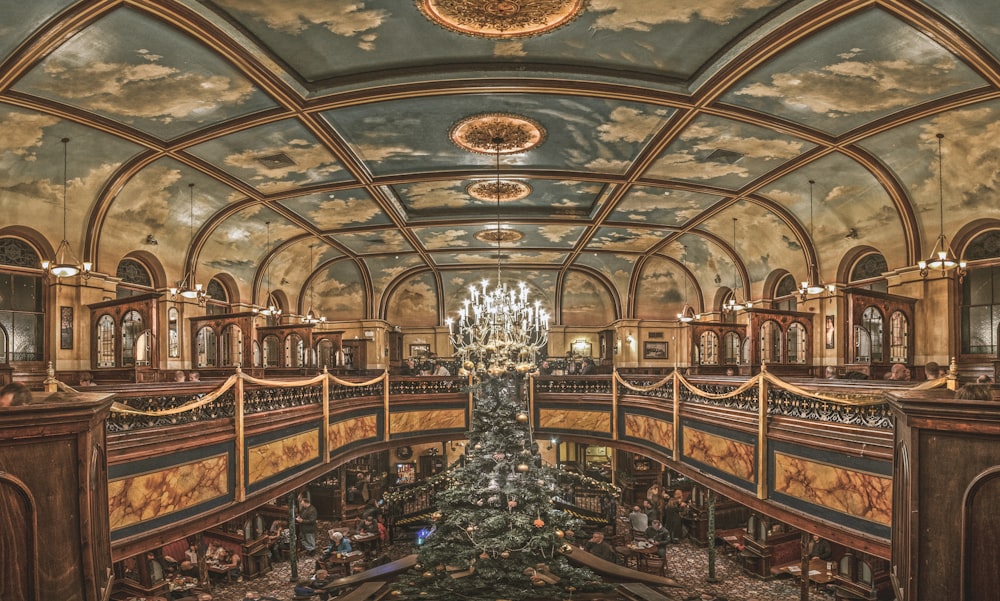 indoor view of brown and blue building with chandeliers turned on