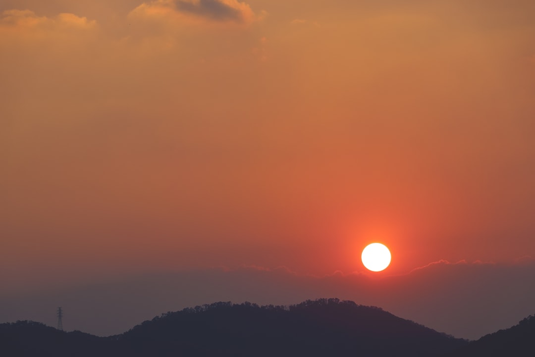 silhouette of mountain range during sunset