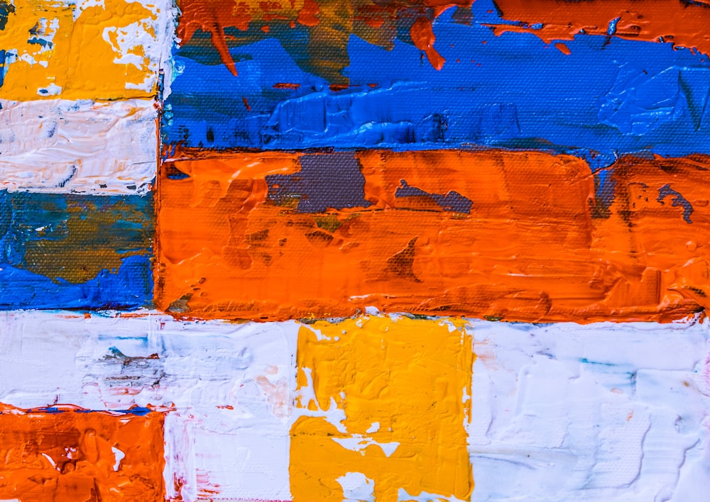 Pintura abstracta azul, naranja y amarilla