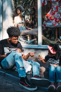 people sitting near mannequin during daytime