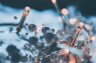 Close-up of golden balloon arrangements intertwined with fairy lights creating a magical atmosphere.