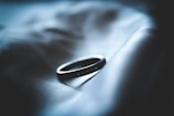 grayscale photo of silver-colored ring