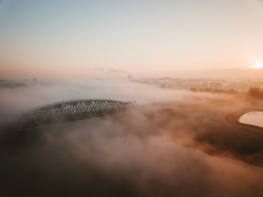 aerial photo of foggy bridge