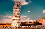 Students enjoying a sunny day at a famous Italian landmark.
