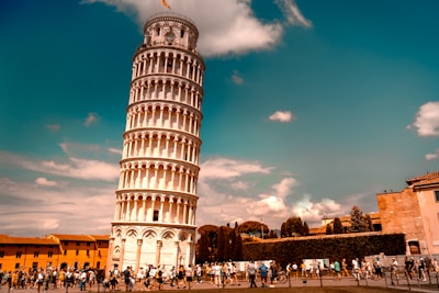 Students enjoying a sunny day at a famous Italian landmark.