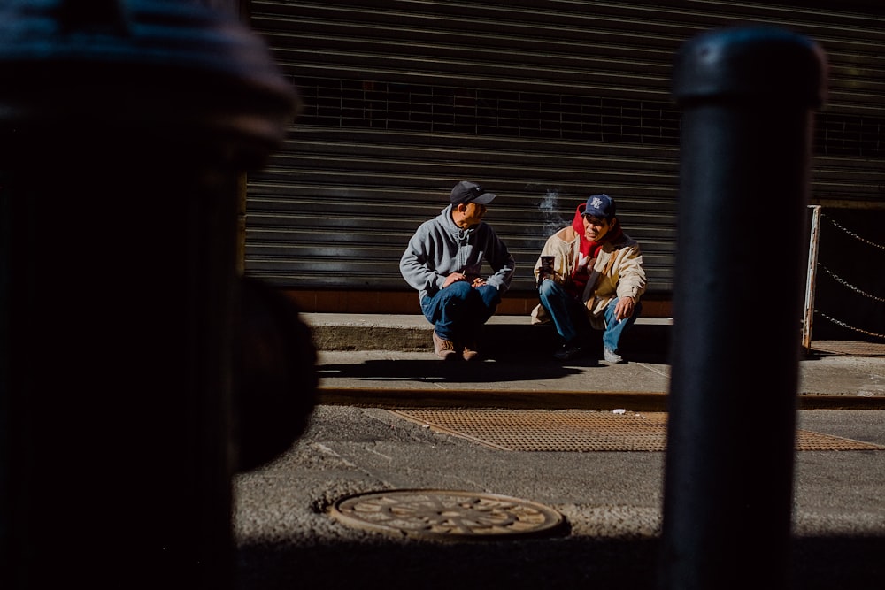 two men sitting down