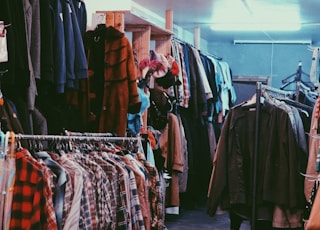 assorted clothes on clothes stand