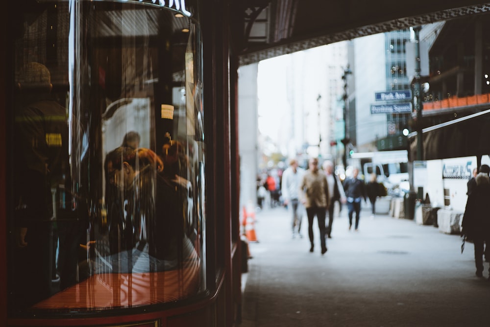 people walking beside building