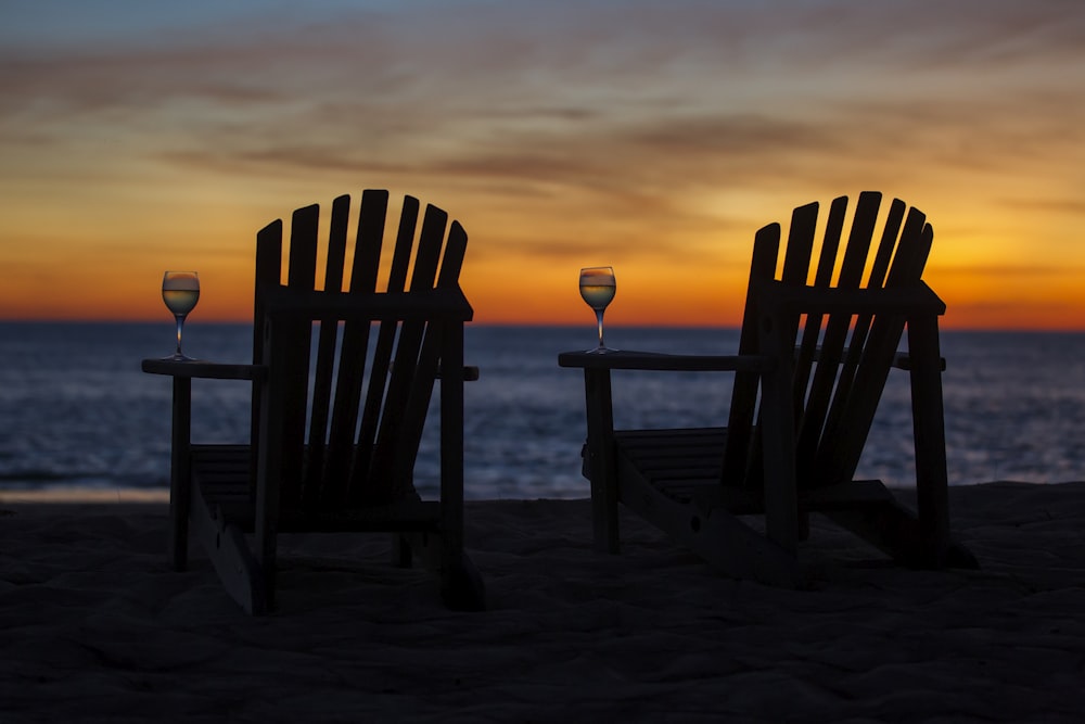 two brown wooden Adirondacks chairs