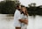 couple hugging each other near body of water
