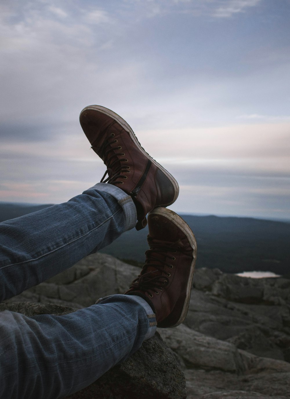 person wearing pair of brown boots