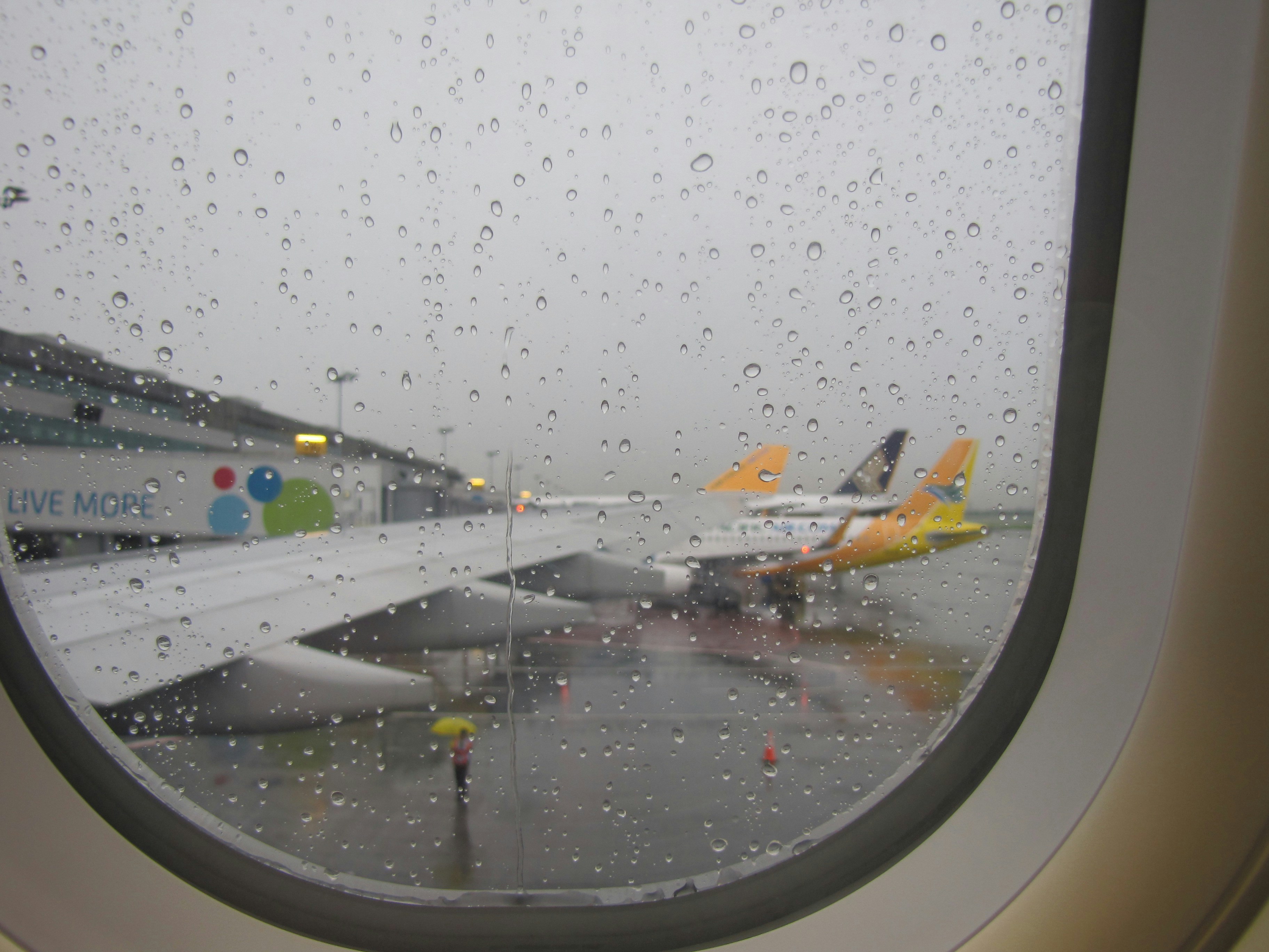 airliner in airport during rainy season