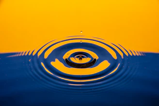 Close-up of a glowing ripple animation spreading from a button click.
