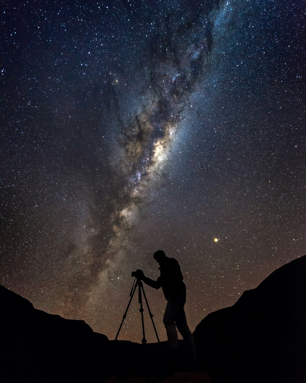 silhouette photo of man under Aurora phenomenon