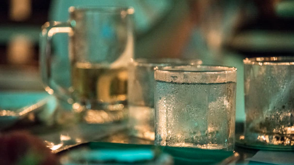 Close-up of glass cups placed on a person's back during a cupping therapy session.