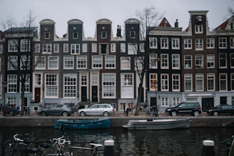 cars and vehicles parked beside building near water