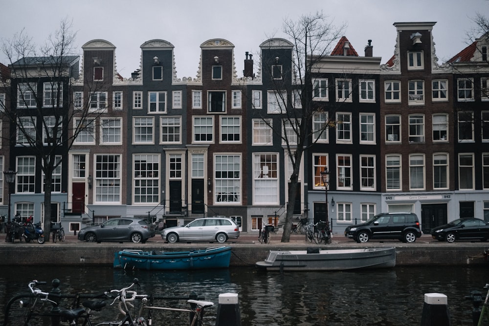 cars and vehicles parked beside building near water