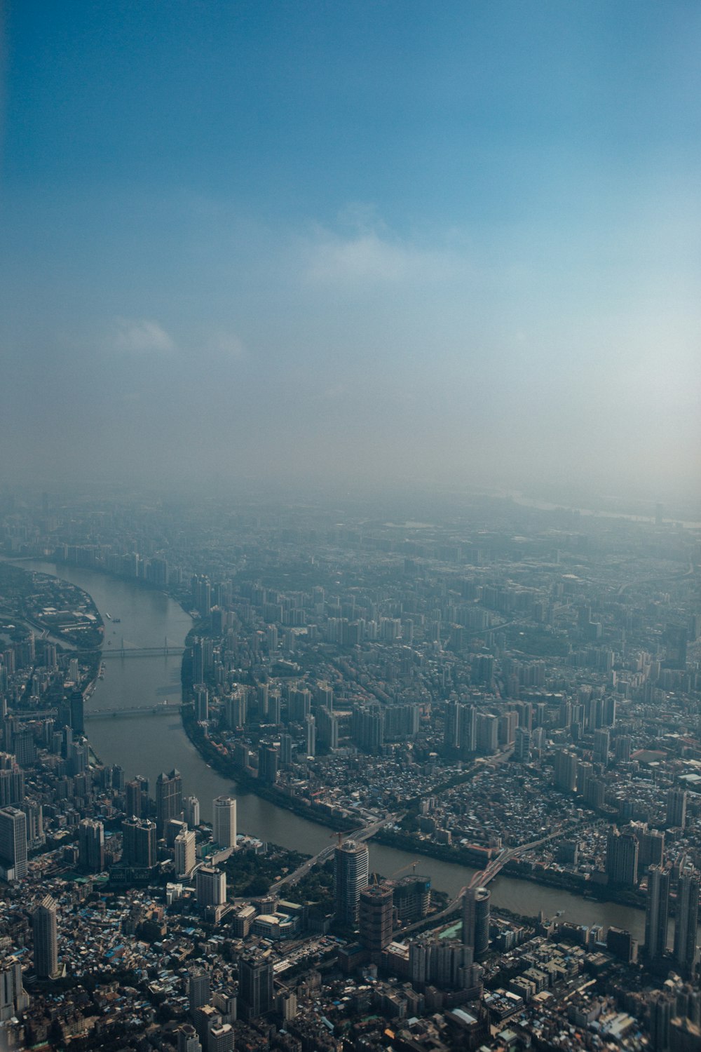 aerial view of city with river in the middle