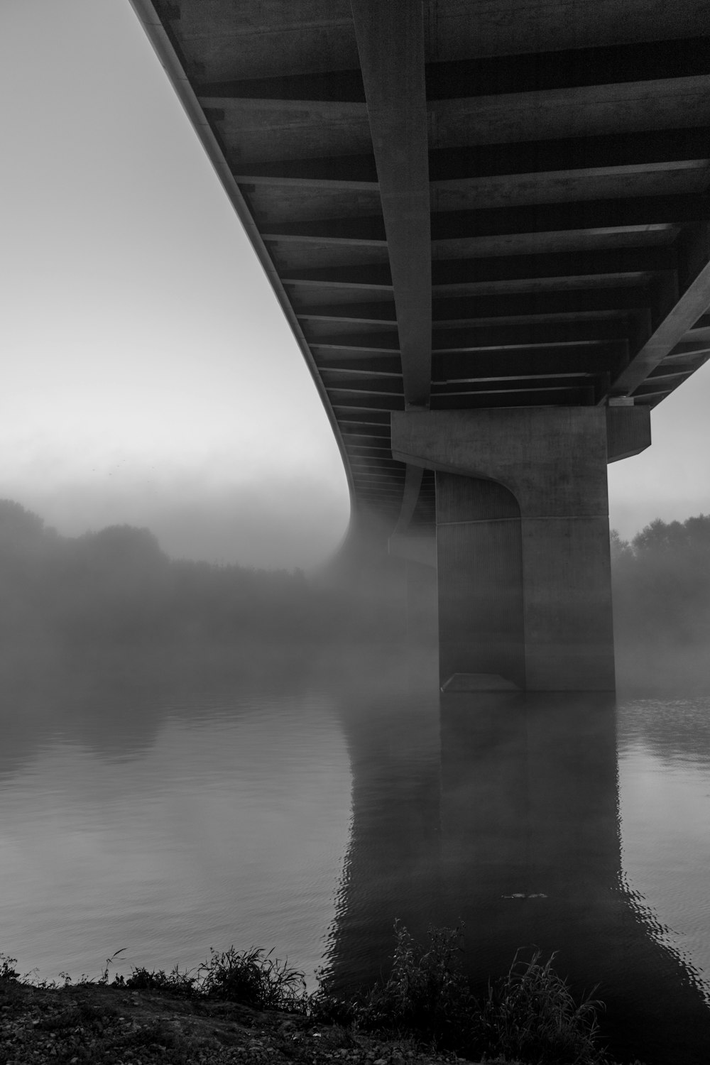 silhouette photography of bridge and river