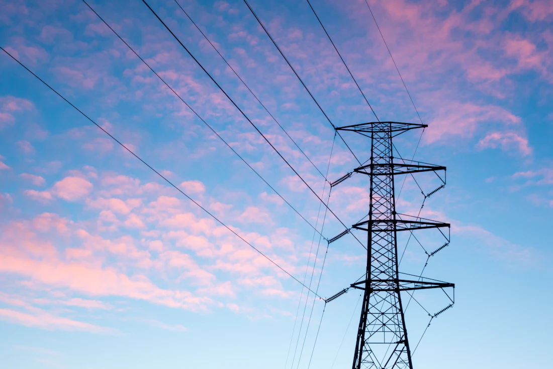 Transmission pylon beneath heavy cloud