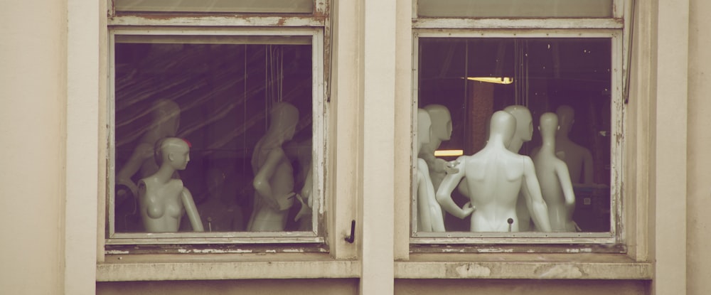 white torso mannequin near window