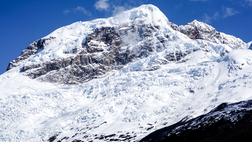 snow-covered mountain during day time