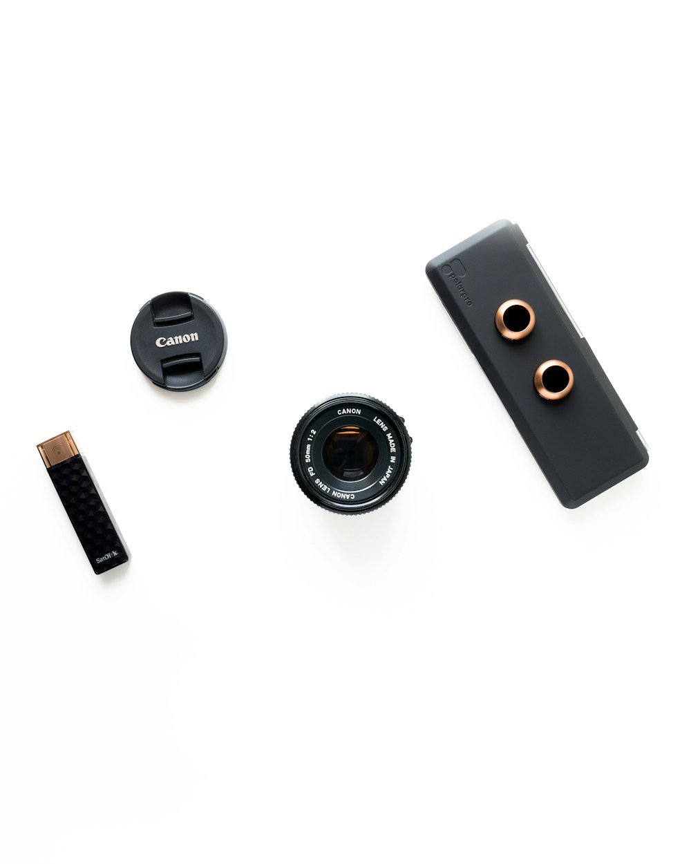 flatlay photography of Canon camera lens