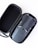 A compact drone with folded arms is neatly placed inside an open black carrying case with a zipper. The drone is sleek and modern, featuring a dark gray color with minor detailing on its surface.