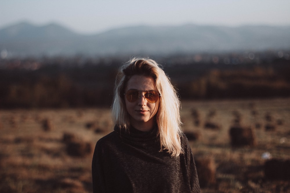 selective focus photograph of woman in black top