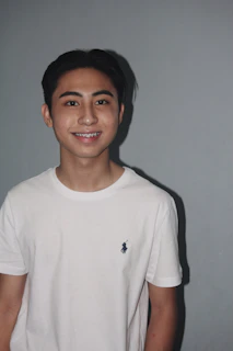 Happy teenager showing off their new smile after orthodontic treatment