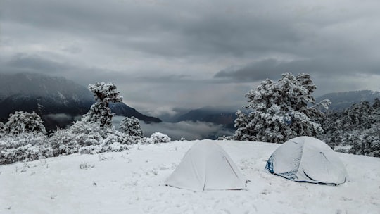 two tents covered in snow in Gokul India