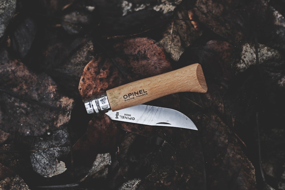 brown and gray Opinel pocket knife