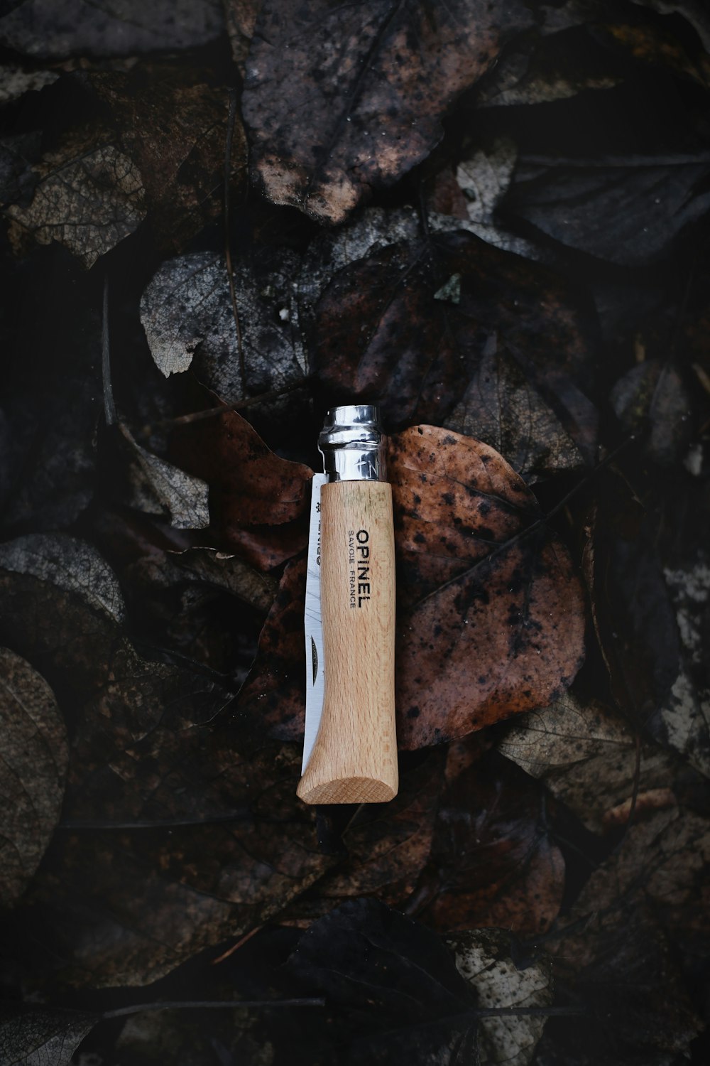 brown and gray Opinel pocketknife