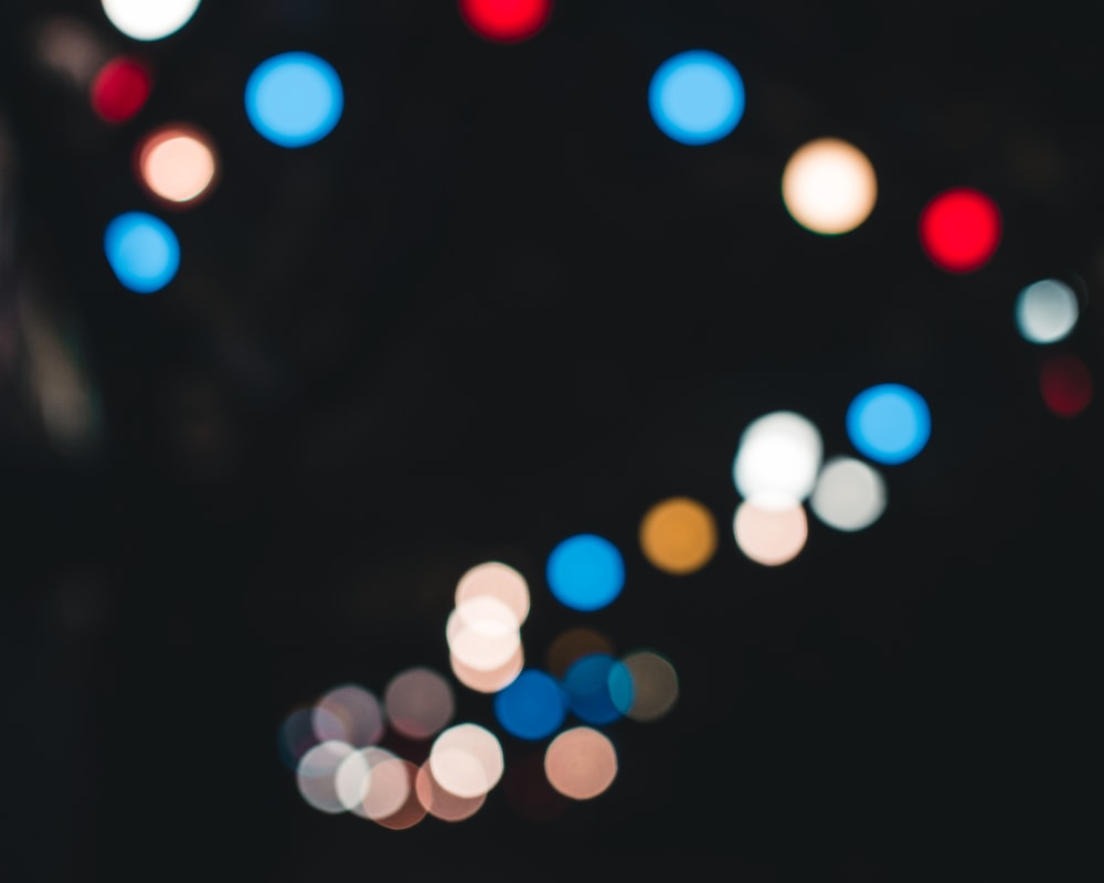 a blurry photo of a city street at night