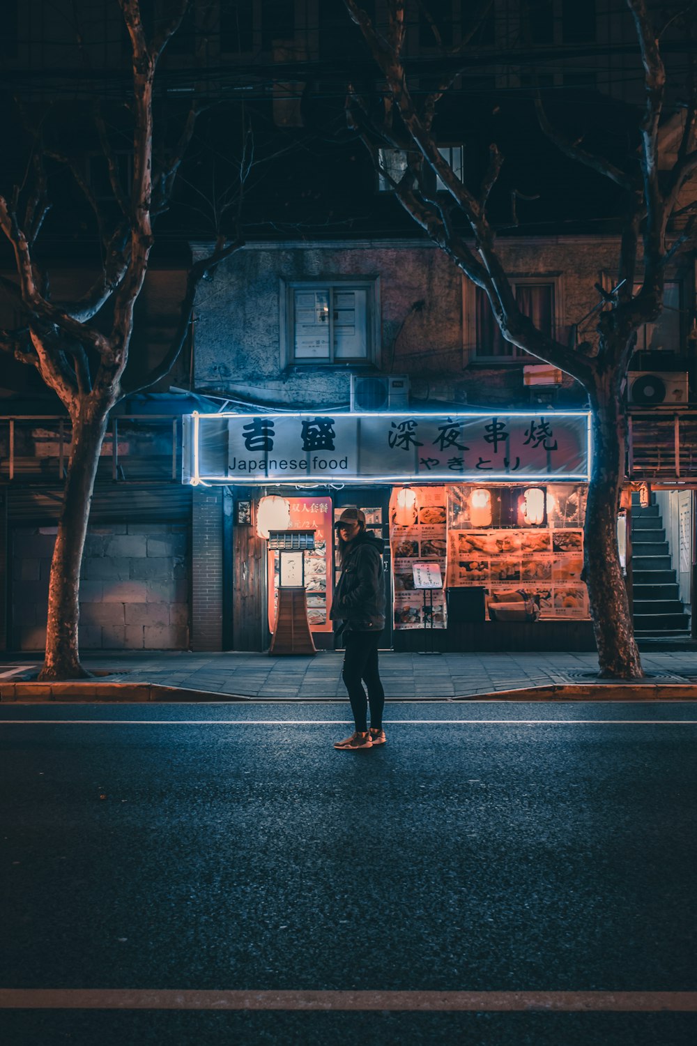 woman standing on storefront