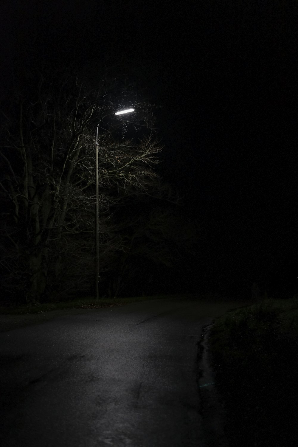 view of empty road under light post