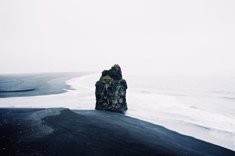 gray rock beside beach