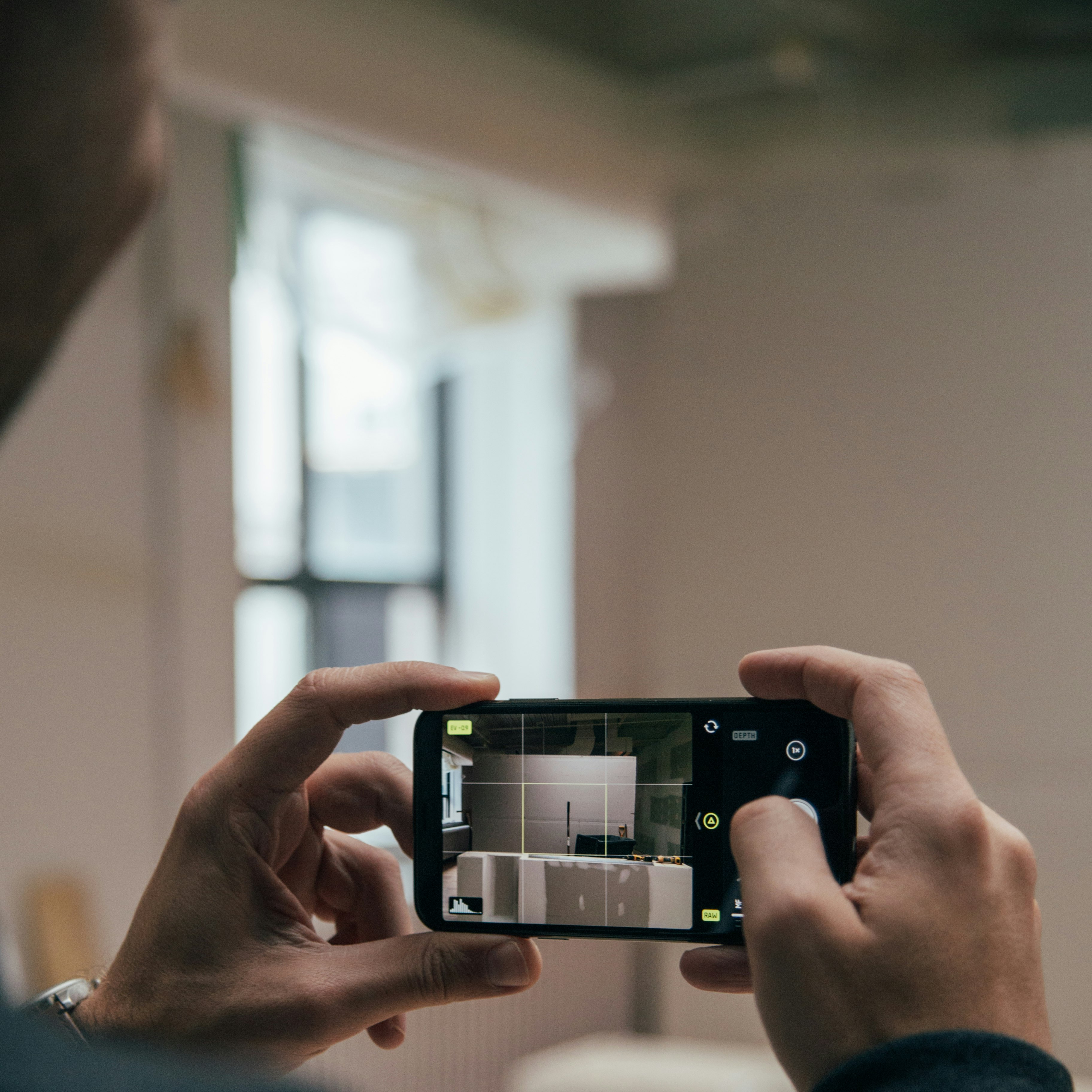 person using smartphone and capturing images