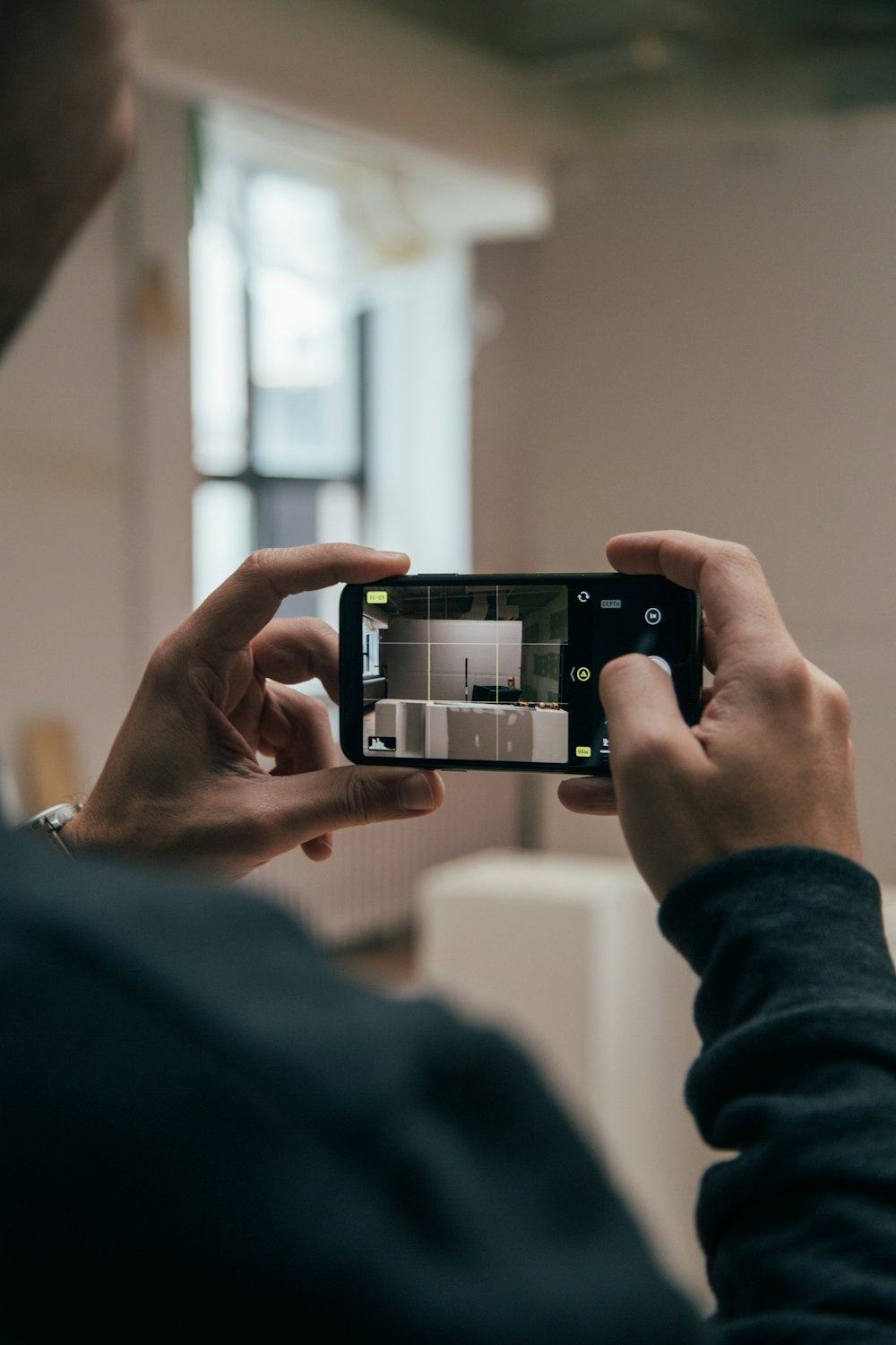 person using smartphone and capturing images