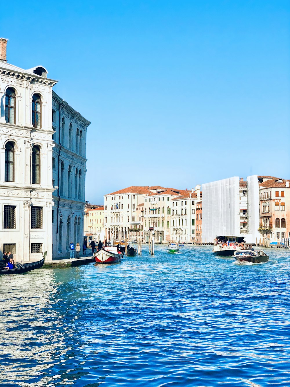 ferries and boats on Grand Canal during daytime