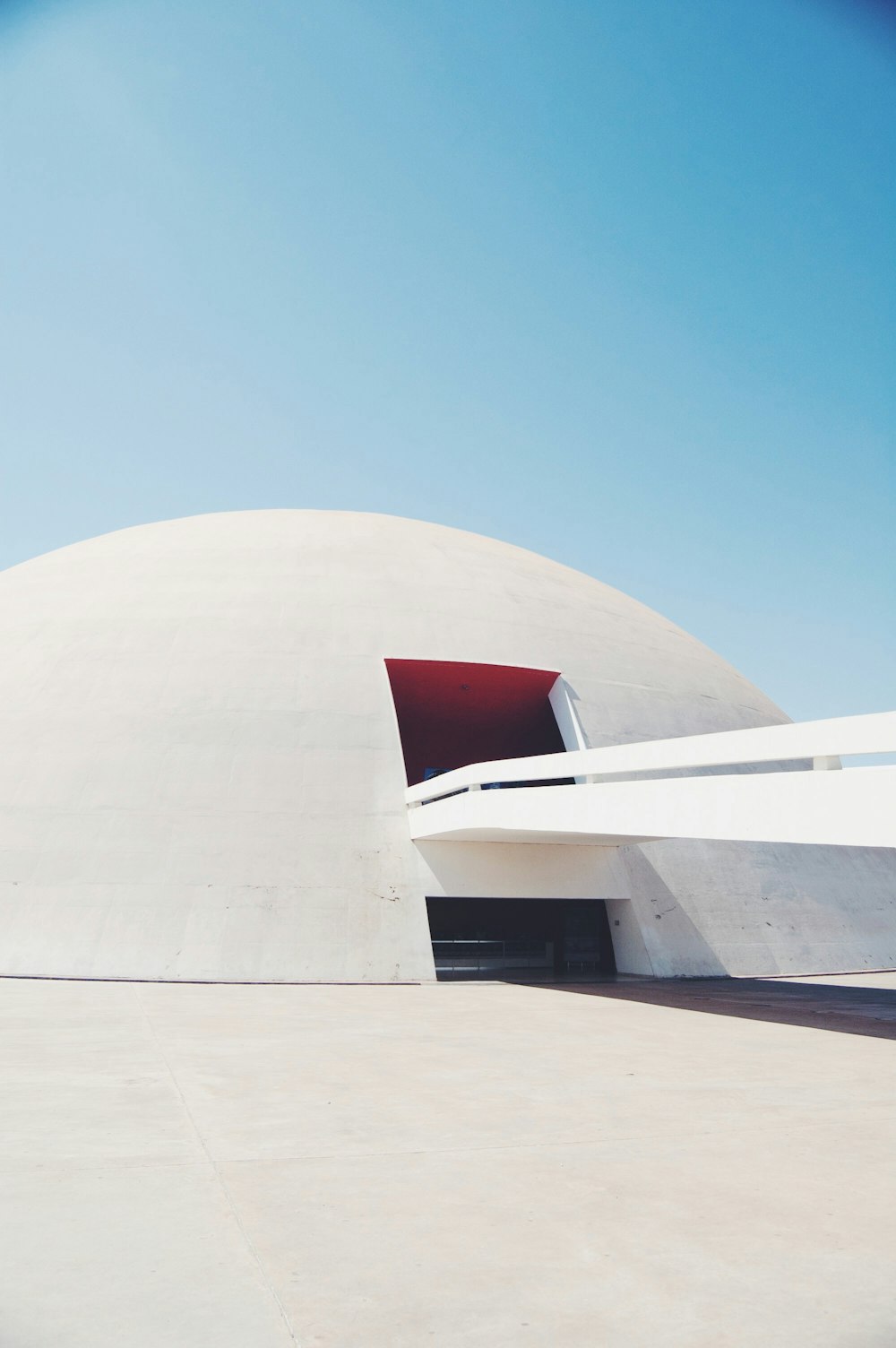 white dome concrete building under clear blue sky during daytime