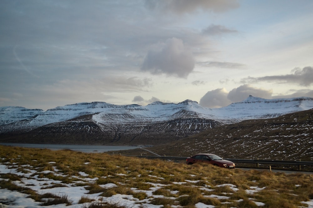 snow covered mountain under cloudy sky during daytime