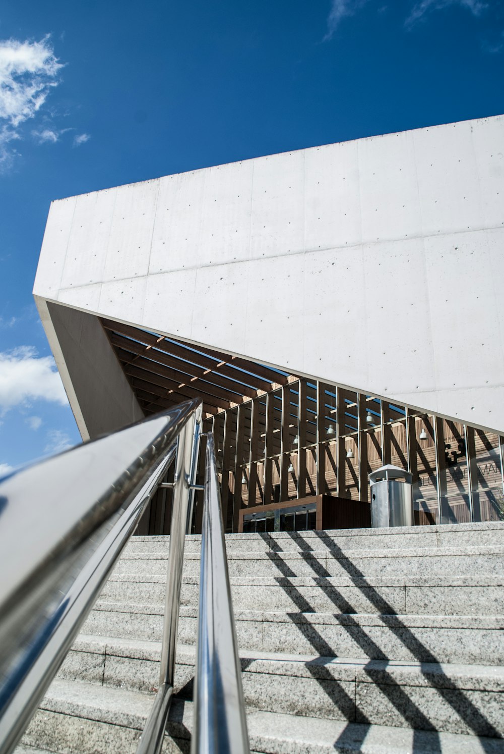 gray concrete stairs with gray handrails