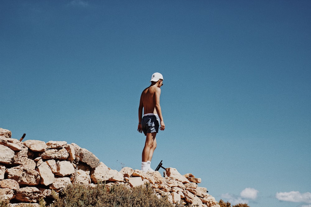 man standing on rock